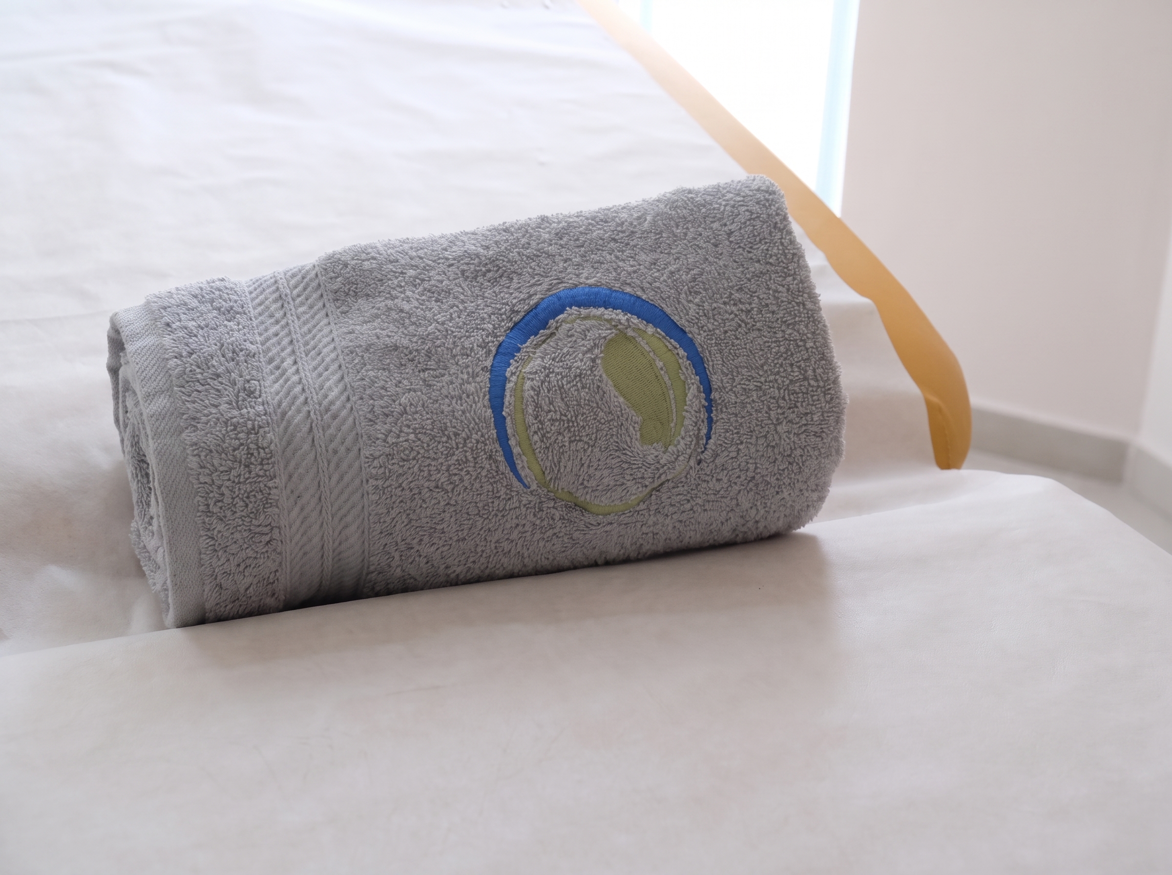 Treatment bed with infrared lamp in a bright private room